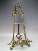 A TWENTIETH CENTURY DECORATIVE BRASS TABLE TOP EASEL, H 53 cm