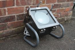 AN INDUSTRIAL STYLE FLOOR LAMP CONVERSION FROM A VINTAGE MILITARY VACUUM CHAMBER, W 40 cm, H 43