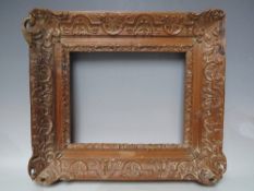 A LATE 18TH / EARLY 19TH CENTURY DECORATIVE CARVED WOODEN FRAME, some damages, frame W 9 cm,