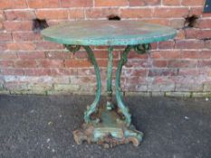A LATE 19TH CENTURY CAST METAL PEDESTAL GARDEN TABLE, the circular top raised on outswept tripod