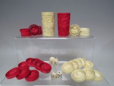 A PAIR OF LATE 19TH / EARLY 20TH CENTURY CHINESE CANTON CARVED IVORY DIE-SHAKERS, each carved in