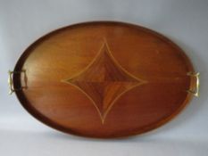 A MAHOGANY OVAL TWIN HANDLED SERVING TRAY, with inlaid decoration, W 64 cm