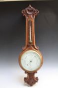 AN EARLY TWENTIETH CENTURY OAK CARVED BAROMETER, with unusual thermometer scale, H 80 cm