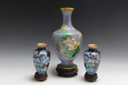 A TWENTIETH CENTURY ORIENTAL CLOISONNE BALUSTER VASE ON STAND, blue ground with floral, bird and