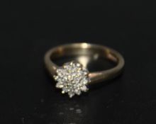 A HALLMARKED 9 CARAT GOLD DIAMOND CLUSTER RING, approx weight 2.4g, ring size J