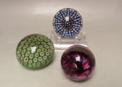 A PERTHSHIRE GLASS MILLEFIORI CANE AND RIBBON PATTERN PAPERWEIGHT, together with a smaller Eirian '
