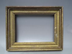 A LATE 18TH / EARLY 19TH CENTURY GOLD FRAME, with decorative design to inner edge, frame W 5.5 cm,