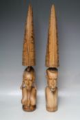 A PAIR OF CARVED HARDWOOD TRIBAL FIGURES, H 55 cm