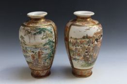 A PAIR OF JAPANESE SATSUMA STYLE VASES, featuring various scenes of families in gardens, four