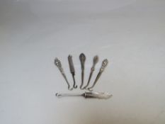 A COLLECTION OF SILVER MINIATURE BUTTON HOOKS, various makers and hallmarks, comprising silver