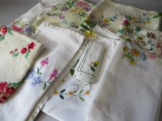 A COLLECTION OF VINTAGE EMBROIDERED AND EMBELLISHED TABLE LINEN ETC, comprising eight table cloths