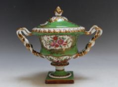 A CONTINENTAL STYLE TWIN HANDLED LIDDED VASE, W 23 cm