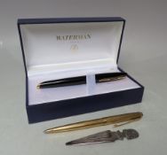 A CASED WATERMAN INK PEN, black body with 18K/750 gold nib, together with a gold plated Parker