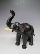 A LIBERTY STYLE LEATHER ELEPHANT, H 40 cm, L 41 cm