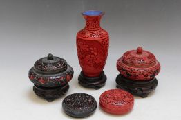 A SELECTION OF ORIENTAL CINNABAR ITEMS, to include two lidded pots on hardwood stands, Dia. 10.5 cm,