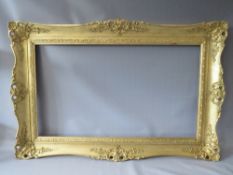 A LATE 20TH / EARLY 21ST CENTURY GOLD SWEPT FRAME, frame W 11 cm, rebate 95 x 55 cm