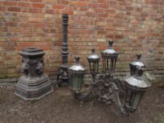 A GOOD QUALITY ORNATE CAST IRON FIVE BRANCH PROMENADE / STREET LAMP, square base with lion masks,