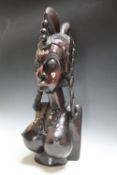 A LARGE CARVED HARDWOOD TRIBAL FIGURE OF A FEMALE BUST WITH DECORATIVE INLAY, H 59 cm