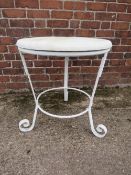 AN ANTIQUE WROUGHT IRON METAL TABLE BASE, fitted with later wooden top, H 69 cm, Dia. 70 cm