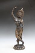 A CAST METAL GILT AND BRONZED ORIENTAL FIGURE OF A DEITY, H 53 cm