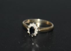 A HALLMARKED 9 CARAT GOLD SAPPHIRE AND DIAMOND RING, approx weight 1.9g, ring size N 1/2