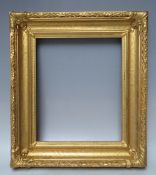 A 19TH CENTURY DECORATIVE GOLD FRAME, with acanthus leaf design to edges and corner