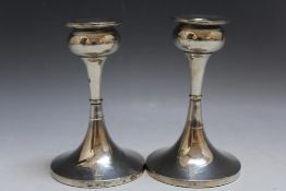 A PAIR OF HALLMARKED SILVER CANDLESTICKS BY S BLANCKENSEE & SON LTD - CHESTER 1927, in an Arts &