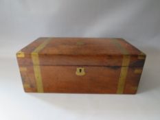 A MAHOGANY BRASS BANDED WRITING BOX, the hinged lid opening to reveal a fitted interior leather