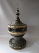 A LARGE ANTIQUE ORIENTAL BLACK LACQUERED PAGODA SHAPED POT WITH LID, with gilt decoration, H 75
