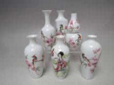 A COLLECTION OF SIX MINIATURE ORIENTAL FINE PORCELAIN VASES, white ground with flowering prunus,