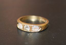 A HALLMARKED 18 CARAT GOLD DIAMOND RING, with a pink stone either side of the diamond (one