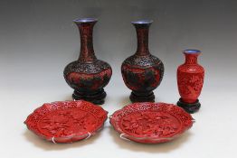 FIVE ASSORTED ORIENTAL CINNABAR ITEMS, comprising two black/red vases, a smaller red vase and two