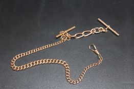 A GOLD PLATED GRADUATED GUARD CHAIN, with short length of 9 carat gold chain and T bar weighing
