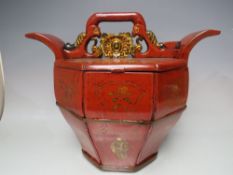 AN ANTIQUE CHINESE RED LACQUERED TEAPOT WARMER, with carved detail to the body, H 32.5, W 39.5 cm