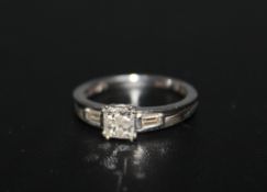 A HALLMARKED 18 CARAT WHITE GOLD PRINCESS AND BAGUETTE CUT DIAMOND RING, approx weight 3.5g, ring