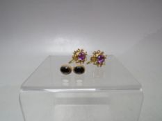 TWO PAIRS OF GOLD GEMSET EARRINGS, comprising a pair of oval gemset earrings stamped 9ct to