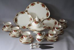 A SELECTION OF ROYAL ALBERT OLD COUNTRY ROSES FINE BONE CHINA TEAWARE, comprising a smaller tea pot,