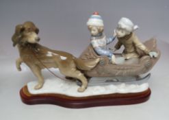 A LARGE LLADRO GROUP FIGURE 'SLEIGH RIDE' 5037, modelled as two children aboard a sleigh pulled by a