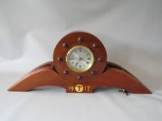 A MANTLE CLOCK MADE FROM THE PROPELLER OF A 1917 AIRCRAFT, in two parts with key, L 69 cm, H 28 cm
