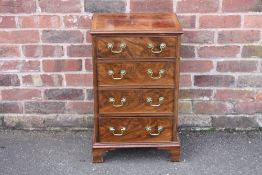 A SMALL ANTIQUE MAHOGANY CHEST OF FOUR DRAWERS, crossbanded to the top, raised on bracket feet, H 74