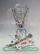 A COLLECTION OF VINTAGE COSTUME JEWELLERY, comprising a selection of bead necklaces to include a