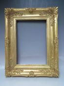 A LATE 18TH / EARLY 19TH CENTURY GOLD SWEPT FRAME, with some restoration, frame W 10 cm, rebate 43 x