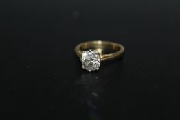 A HALLMARKED 18 CARAT OLD CUT DIAMOND SOLITAIRE RING, the single stone being of a good colour and