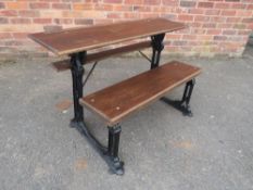 A CAST IRON VICTORIAN SCHOOL BENCH BY FISHER OF WOLVERHAMPTON, with cast iron frame and later oak