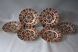 A SET OF SIX ROYAL CROWN DERBY IMARI PATTERN 1128 DINNER PLATES, all marked as seconds, Dia. 27 cm