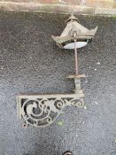 A CAST IRON EXTERIOR / COURTYARD LANTERN ON WALL BRACKET, with copper hood, approx. overall H 98 cm,