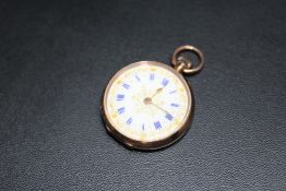 A HALLMARKED 9 CARAT GOLD OPEN FACED MANUAL WIND FOB WATCH, with gold inlay enamel dial and blue