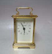 A MODERN LEATHER CASED BRASS 'CHURCHILL' CARRIAGE CLOCK, one glass panel damaged, with key, clock