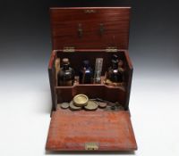 A MAHOGANY APOTHECARY CABINET AND CONTENTS, W 34 cm