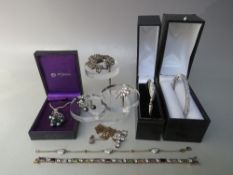 A SELECTION OF SILVER JEWELLERY ITEMS, to include two bangles, a necklace and earring set and a